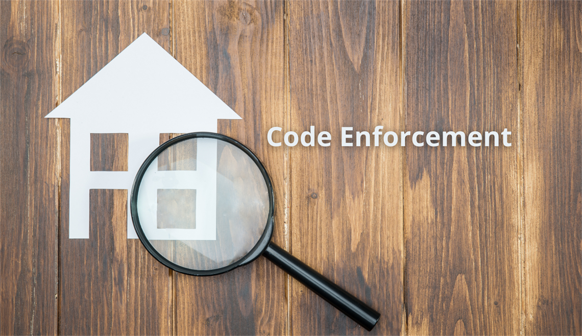 Code Enforcement House and Magnifier