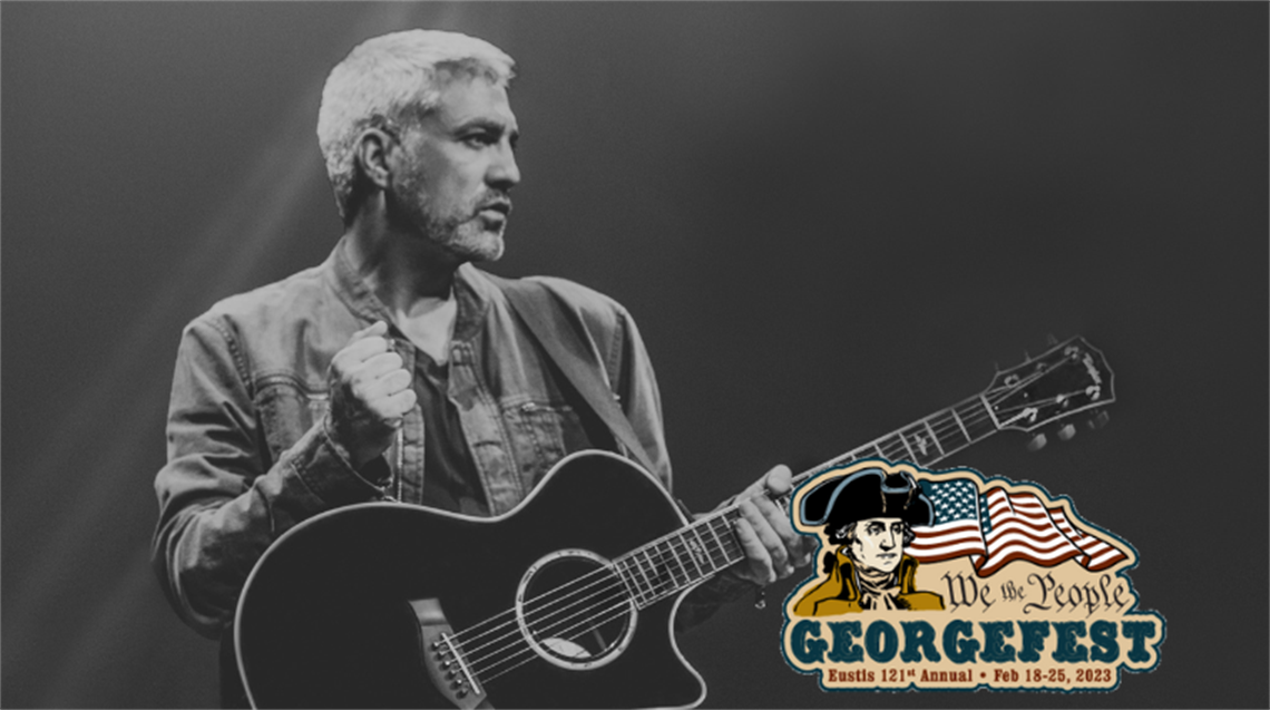 Taylor Hicks in black and white playing guitar