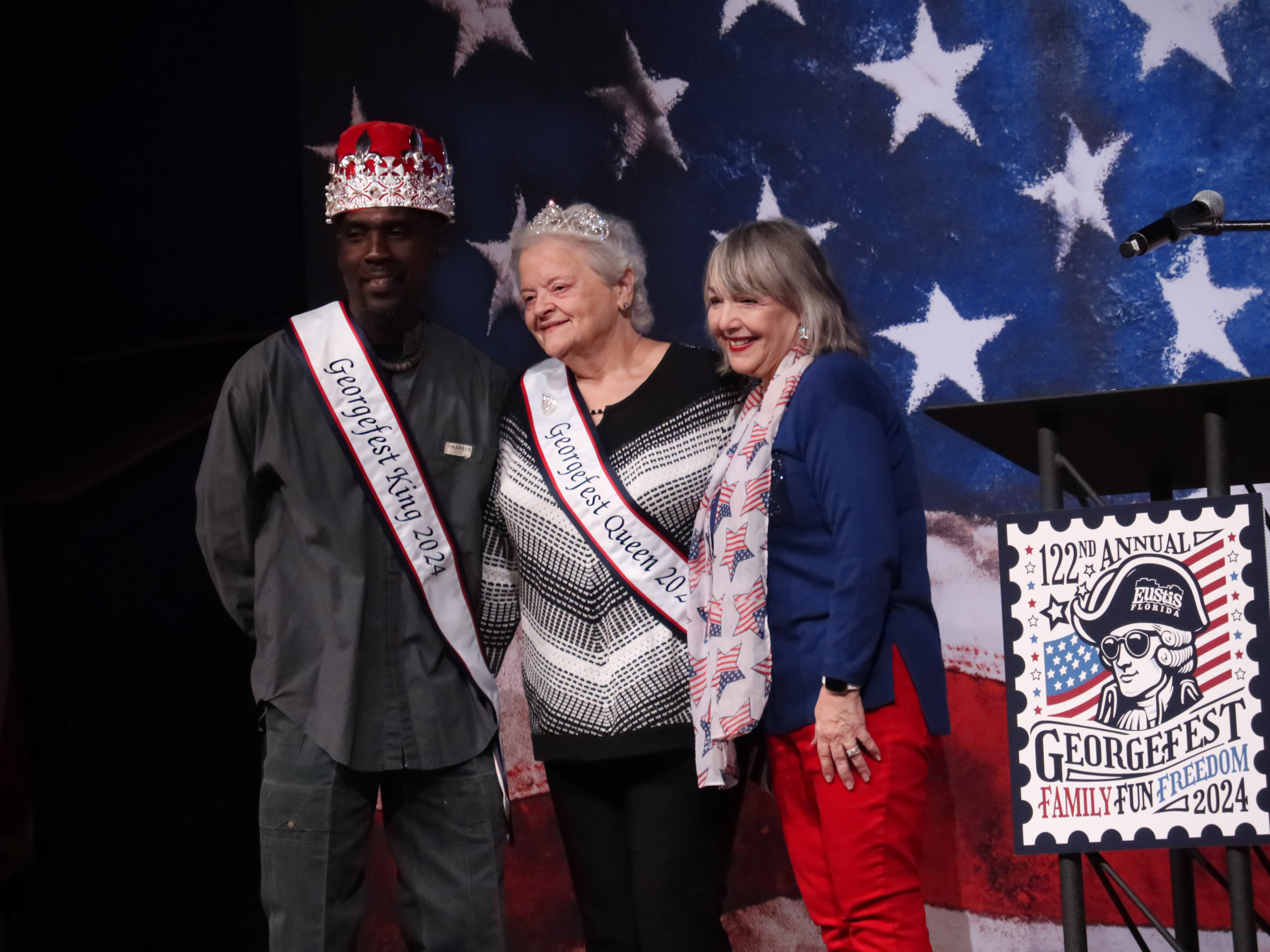 Georgefest 2024 King Johnnie Saunders and 2024 Georgefest Queen Stephanie Carder with Chamber Director Marie Aliberti