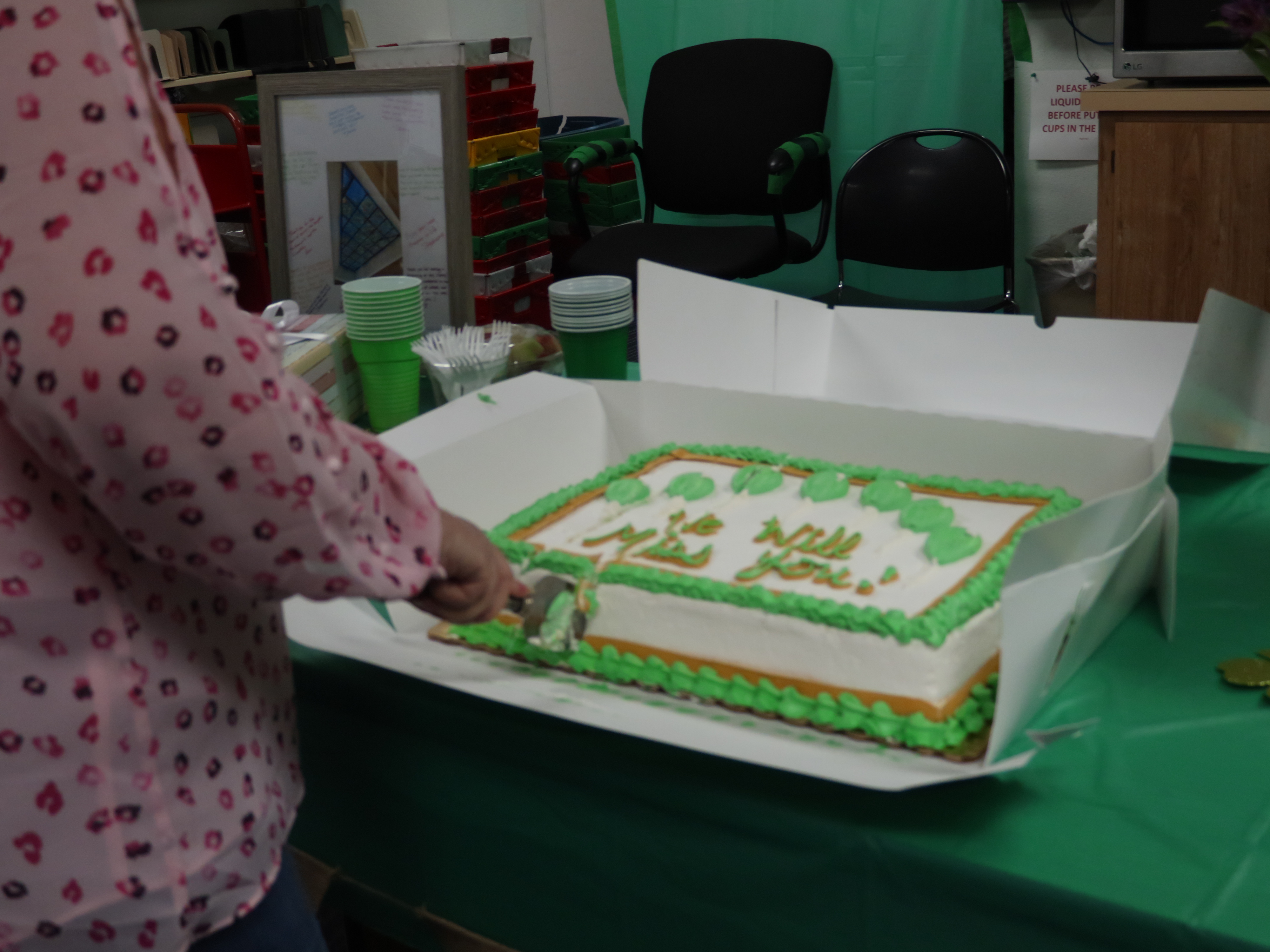 Celeste Bringard cutting her retirement cake