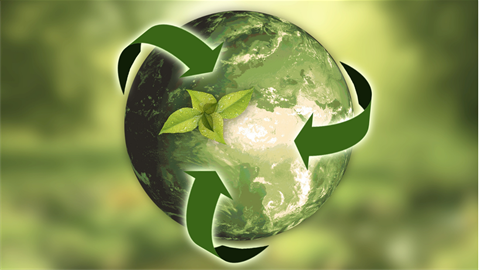 Sustainability of hand holding a green earth