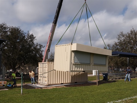 Press Box being placed