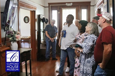 Eustis City Commission and visitors on a tour of the Clifford House.