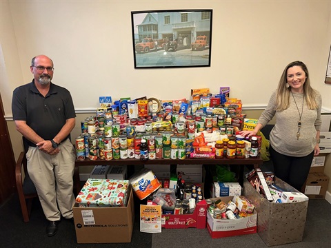 Tom Carrino and Jamie Tusing photo OP with donations collected for W.I.N 1 Ministries local food pantry